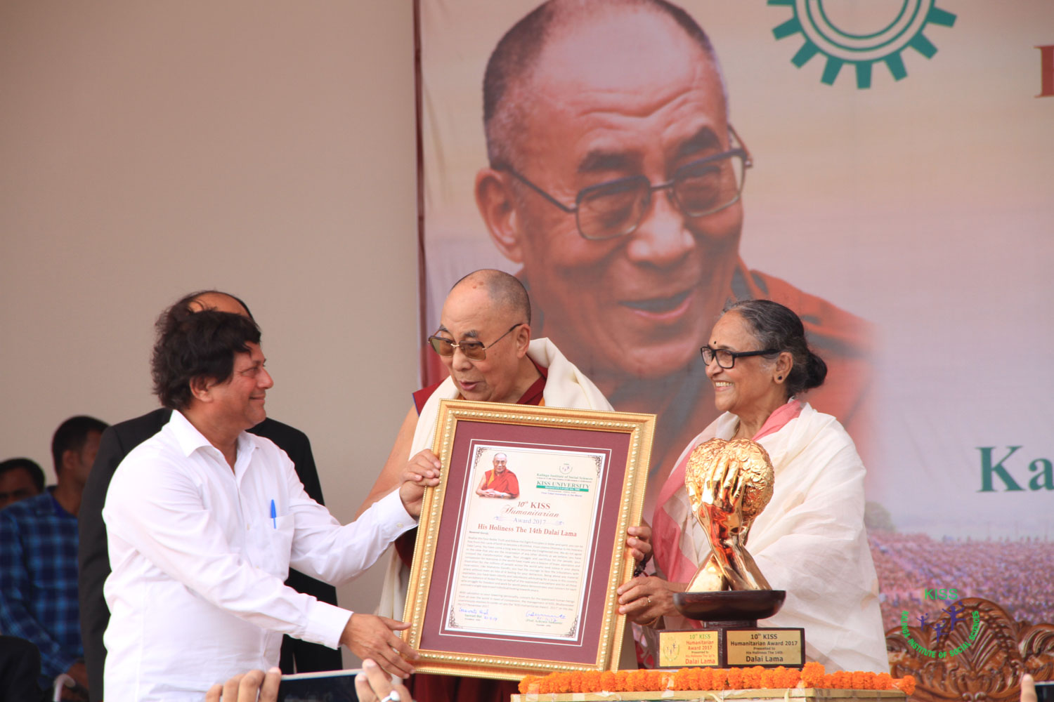 His Holiness The Dalai Lama receiving the KISS Humanitarian Award in the presence of esteemed dignitaries