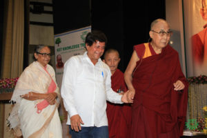 His Holiness The Dalai Lama proceeding to the stage with prof. Achyuta Samanta at KIIT University Bhubaneswar