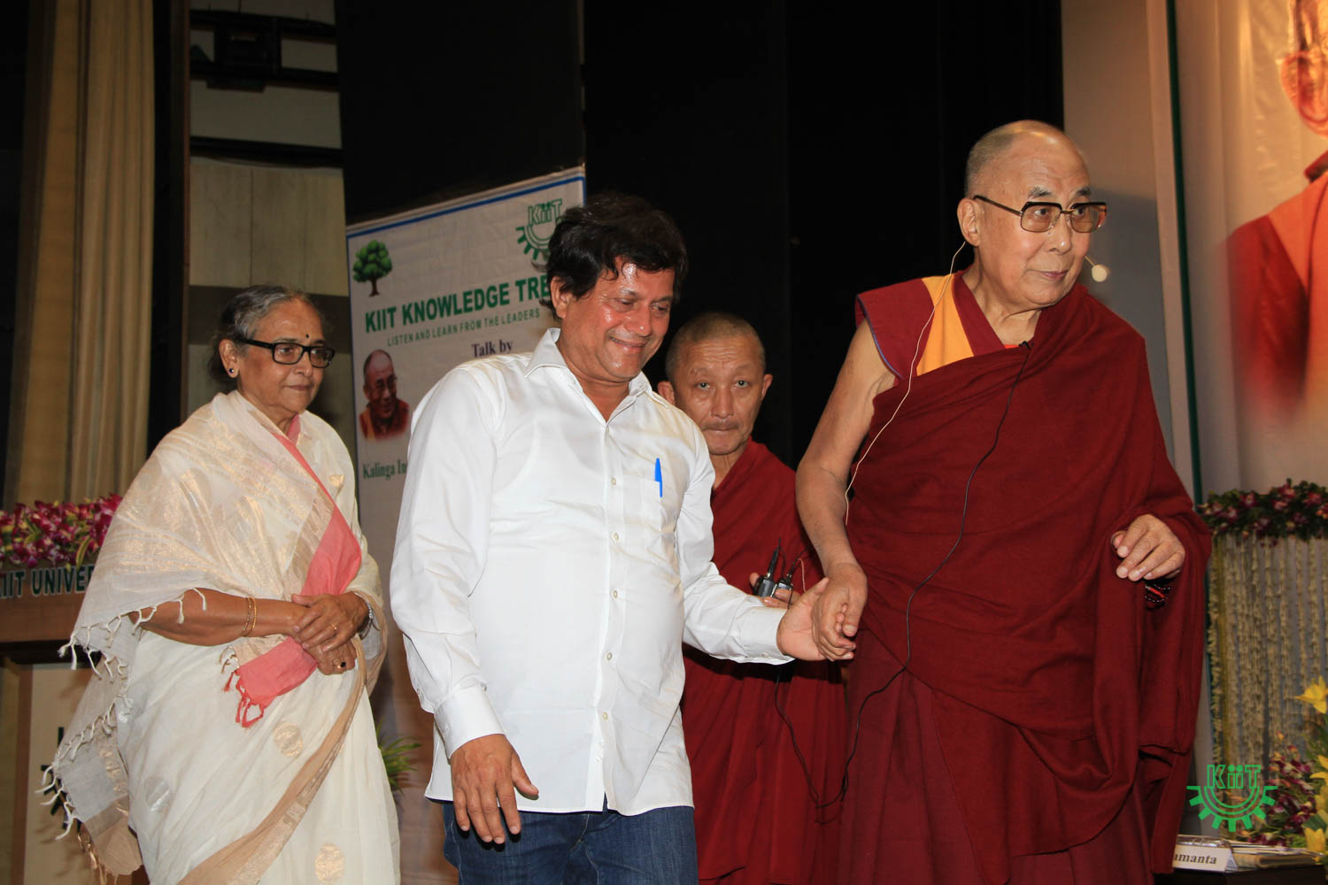His Holiness The Dalai Lama proceeding to the stage with prof. Achyuta Samanta at KIIT University Bhubaneswar
